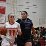 Teagan Petek takes on contact as she drives to the hoop. Ben Ray / The Reporter