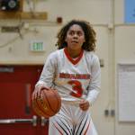 Leilah Spalding take a peek at the scoreboard against Foster. Ben Ray / The Reporter