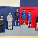 Jackson Mostrom atop the podium. Photo provided by Desiree Mostrom.