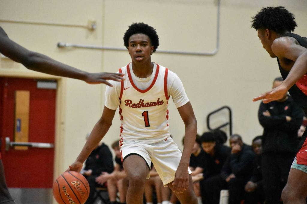 Dennis Johnson eyes down his teammates in the second half of the first round of the district tournament. Ben Ray / The Reporter