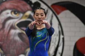 Hazens Aubrey Le focusing in during her balance beam routine. Ben Ray / The Reporter