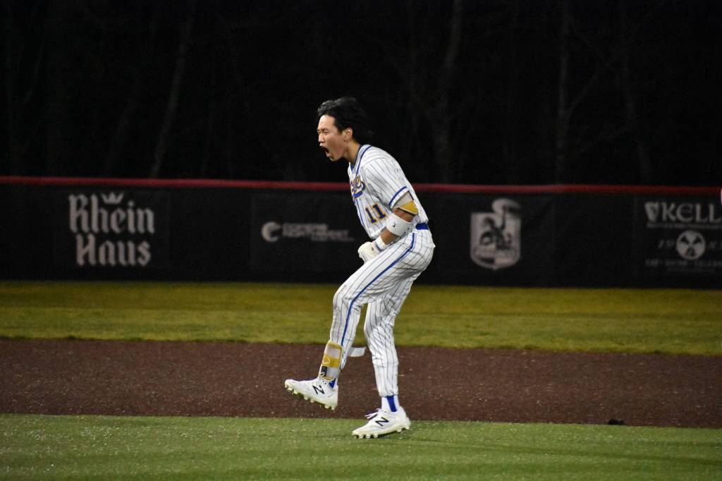 Kyle Tat celebrates the walk-off win over Kentlake after his double. Ben Ray / The Reporter