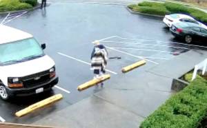 Surveillance footage of Sergeant Russell Radkes shooting of Anthony Tovar, 43, showed Tovar drop an apparent shotgun on the ground after Radke fired two shots. (Screenshot)