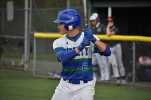 Mac Reynolds, in the batters box, eyes down the Kang pitcher late in the game against Lake Washington. Ben Ray / The Reporter