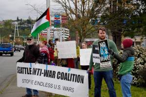 Various members of the Washington Against Nuclear Weapons Coalition and other people protest the Israel-Hamas war on Grady Way. Photo by Joshua Solorzano/Renton Reporter