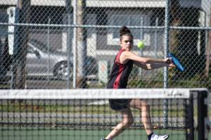 Rentons Michelle Arjona-Reyes lines up a backhand shot against Hazen. Ben Ray / The Reporter