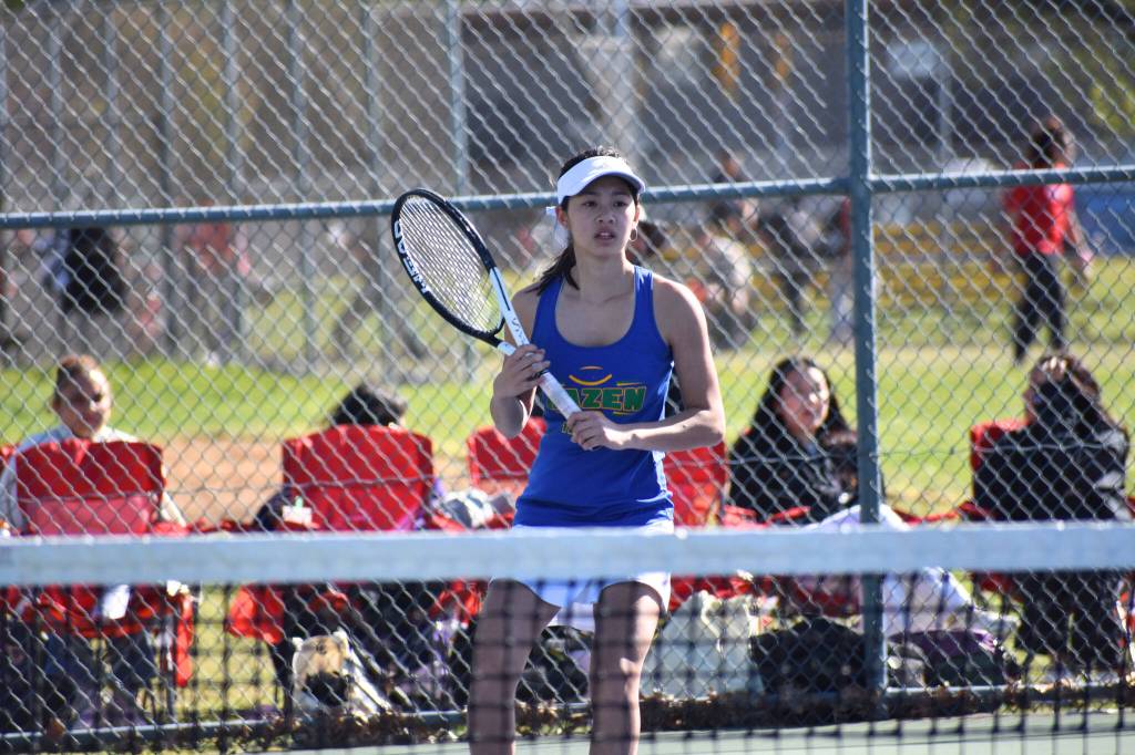 Megan Ngo awaits a return shot against Renton High. Ben Ray / The Reporter