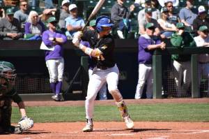 Kyle Tat prepares to take a swing at a pitch inside T-Mobile Park. Ben Ray / The Reporter