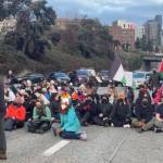 A scene of the Jan. 6, 2024, protest that blocked a freeway on-ramp in Seattle. (Screenshot)