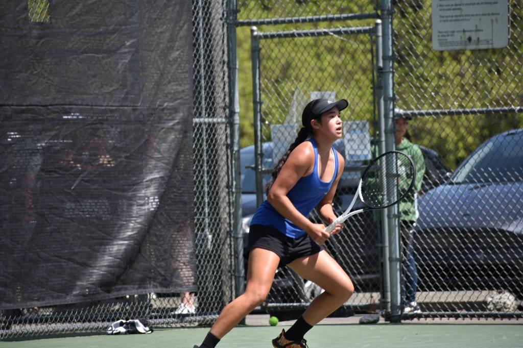 Tayler Conway makes a cut and looks to hit a shot at Lower Woodland Park. Ben Ray / The Reporter