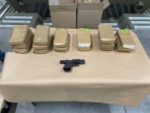 Law enforcement seized more than 15 kilograms of fentanyl powder and a firearm from the suspects vehicle on May 9. Agents seized an additional kilogram of fentanyl powder in the search of an apartment of one of the suspects living in Renton. (Courtesy of the Department of Justice.)