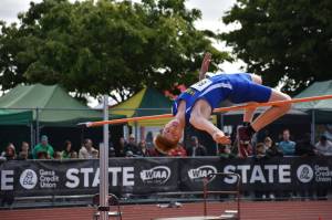 Hazens Illia Biezak leaps over the bar. Ben Ray / The Reporter