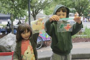 Nova and Matteo show off their crafts that they had made at the Kids Patch tent at the Renton Farmers Market. Photos by Bailey Jo Josie/Sound Publishing