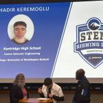 Gina Breukelman and Pat Cazeau with Bahadir Kremoglu as hes signing his letter of intent. Photo by Joshua Solorzano/The Reporter