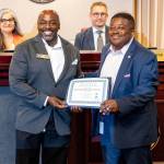 Renton City Council President Ed Prince presenting James Alberson Jr. his Association of Washington Cities Certificate of Municipal Leadership at the July 8 Renton City Council meeting. Photo by Joshua Solorzano/The Reporter