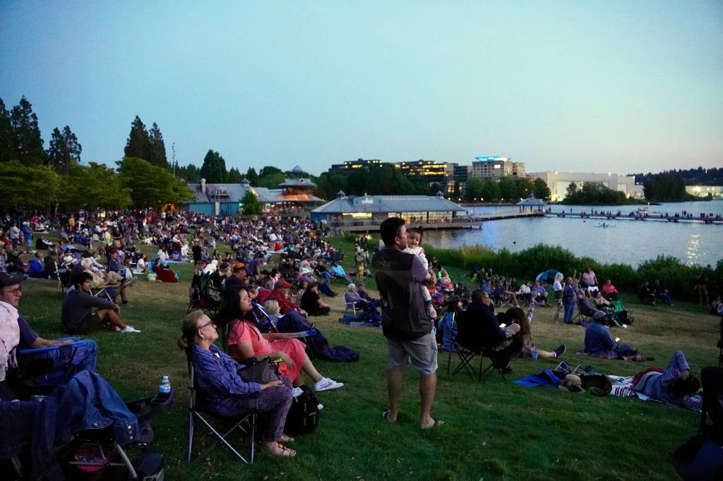 People gathered watching the Kennydales and waiting for the drone show at Gene Coulon Park. Photo by Joshua Solorzano/The Mirror