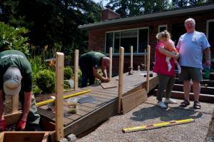 Corin Goodwin and Robert Goodwin with their granddaughter as her new ramp gets built. Photo by Joshua Solorzano/Renton Reporter