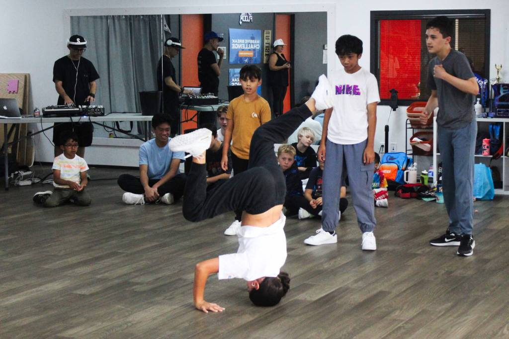 Photos by Bailey Jo Josie/Sound Publishing
Heidi, 12, balances on her head while DJ Fever, Benjamin, Joshua, Rowan, Santino, Dexter, Kaipo and Kai look on.