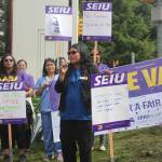 Photos by Bailey Jo Josie/Sound Publishing
Renton City Councilmember Kim-Khánh Van spoke to the crowd, ending her speech with When we fight, we win!