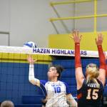 Arisa May-Kelly tries a finesse shot to beat the Juanita blockers. Ben Ray / The Reporter