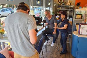 While filming the Issaquah Restaurant Spotlight series, Troy Kline tastes his favorite Thai dish at Sip Thai Zooom alongside restaurant owner Joon Likit.