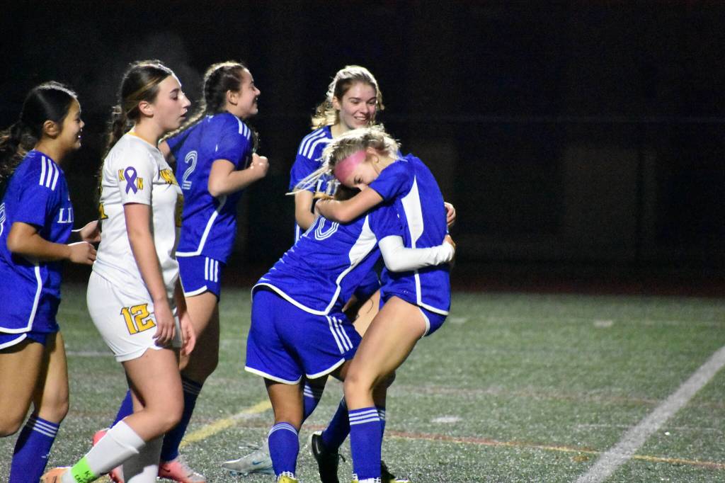 Sophomore Addie Streur celebrates with Skyla Yu who recorded the assist on her goal. Ben Ray / The Reporter