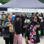 Renton Farmers Market attendees enjoy some bakery goods in June. Photo by Bailey Jo Josie/Sound Publishing.