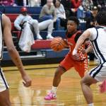 Isaac Elegan drives to the basket against Lindbergh. Ben Ray / The Reporter