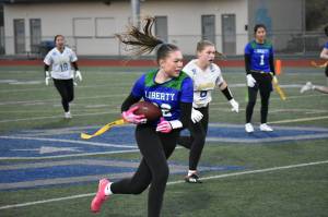 Alison Frank makes a catch and runs the ball upfield. Ben Ray / The Reporter