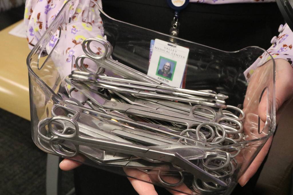 Medical scissors were passed out to hospital workers and ribbon cutting attendees to help cut the ribbon and officially kick-off the Cancer Center in Renton. Photo by Bailey Jo Josie/Sound Publishing.
