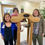 (Left to right) Infusion Center Manager Chermaine Wulff, Director of Philanthropy & Volunteer Services Carrie Murayama and Chief Communications & Philanthropy Officer Liz Nolan showcase the new Cancer Centers Cancer Bell, which will be rung by cancer patients to mark the end of their treatment. The inscription on the bell says, Life is not measured by the number of breaths we take, but by the moments that take our breath away. Smile - this is one of those moments! Photo courtesy of Valley Medical Center.