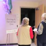 Two women look into the future space for the centers Oncology & Hematology Clinic, which will be part of Phase 2. Photo by Bailey Jo Josie/Sound Publishing.