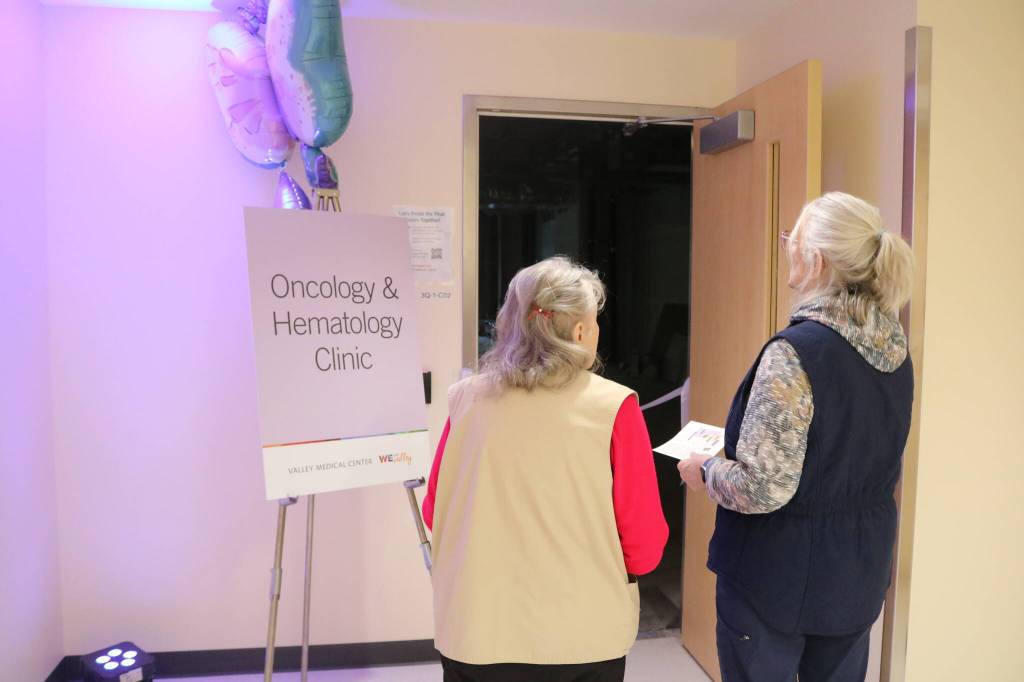 Two women look into the future space for the centers Oncology & Hematology Clinic, which will be part of Phase 2. Photo by Bailey Jo Josie/Sound Publishing.