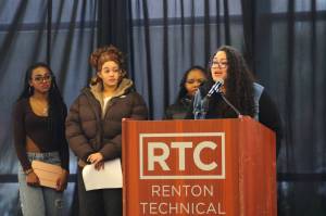 Kirsten Thornton (right) speaks at the Black History Month forum about the Renton School Districts upcoming HBCU Delegation and Tour. Students who part of previous HBCU tours also spoke about their experiences. Photo by Bailey Jo Josie/Sound Publishing.