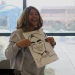Fancy Vargas of Elevate PR holds her caricature portrait by Markas Odom, who is @brother_caricature on Instagram. Photo by Bailey Jo Josie/Sound Publishing.