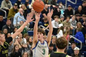 Max Vermeulen takes a three-pointer in the win over Bishop Blanchet. Ben Ray / The Reporter