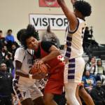 Jordan Agosto swarmed by Foster defenders in District 2 championship game. Ben Ray / The Reporter