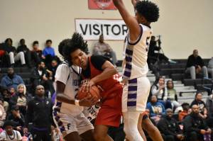 Jordan Agosto swarmed by Foster defenders in District 2 championship game. Ben Ray / The Reporter