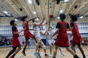 Isaac Roberts reaches for a pass against Silas. Photo taken by Maria Dorsten.