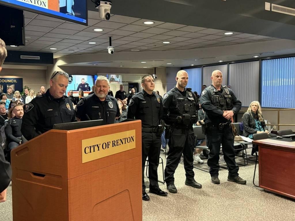Chief Jon Schuldt  with the first set of meritorious awards recipients. Courtesy photo.