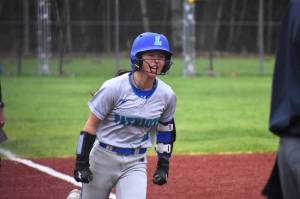 Kaila Siu gives a yell after hitting a two-run home run in the seventh inning. Ben Ray / The Reporter
