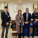 American Legion Post 19 members, Officer Blake Bowie, the Valley Communications representative and Renton Mayor Armondo Pavone. Photo by Joshua Solorzano/The Reporter