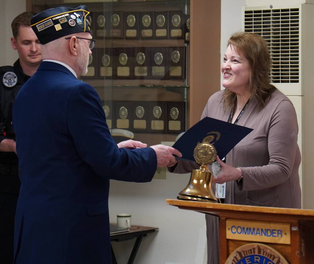 American Legion Post 19 member presenting a certificate to the Valley Communications representative. Photo by Joshua Solorzano/The Reporter.