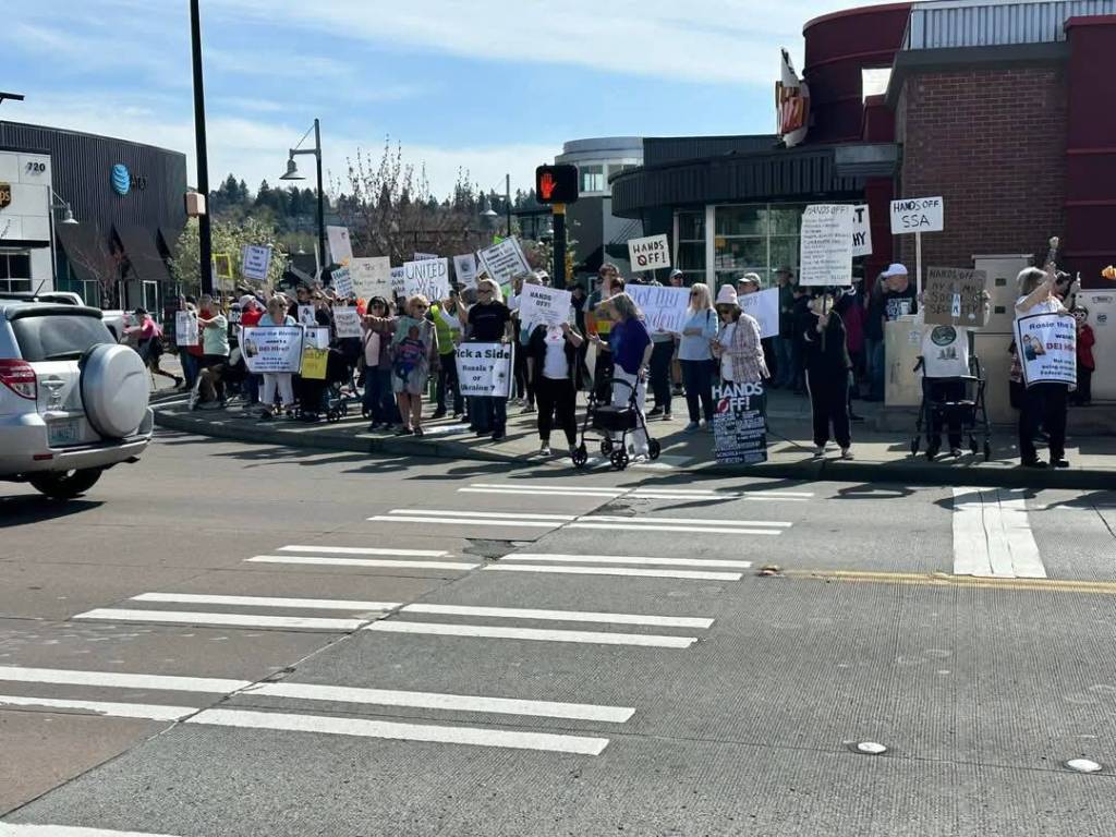 Located at the Landing, between the Red Robin and Boeing, the April 5 Hands Off protest in Renton drew a large crowd. Photo courtesy of Alice Lockridge.