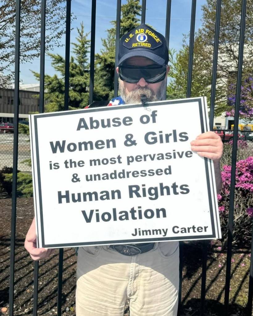 One Air Force veteran held a sign referencing abuse towards women and girls. Photo courtesy of Alice Lockridge.
