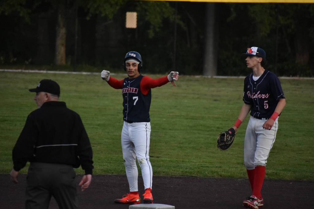 Tyson Glenn Thomas does a doubles celebration against Nathan Hale. Ben Ray / The Reporter