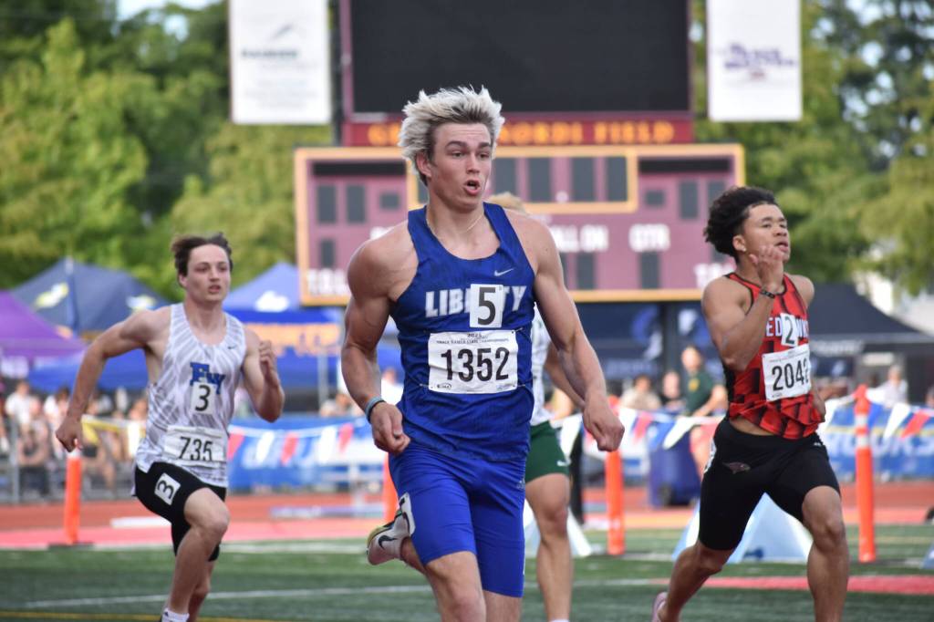 Sutten Flint runs the 200-meter dash. Ben Ray / The Reporter