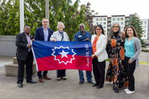 Renton City Councilmember Ed Prince, Mayor Armando Pavone, Councilmembers Valerie O'Halloran, Kim-Khánh Văn, Ruth Pérez and Carmen Rivera hold up the Juneteenth flag at the city's inaugural Juneteenth flag raising on Wednesday, June 18. Courtesy photo.