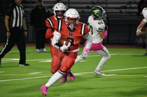 Senior Patrick Turner keeps his eyes downfield with the ball in his hands. Ben Ray / The Reporter