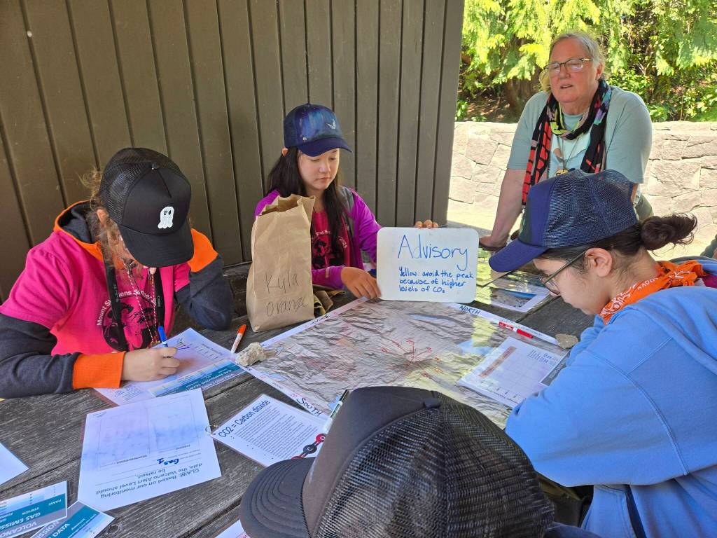 Lorelei Correa (far right) and the other GeoGirls take part in the Volcano Crisis Mission activity, where they assumed the role of scientists during a period of increasing volcanic unrest and decided what to do during different phases of activity.